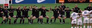 The NZ All Blacks rugby team squat in a haka dance prior to playing England.